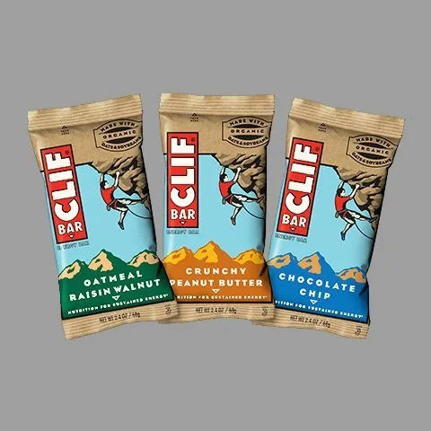 A group of three clif bars sitting next to each other.